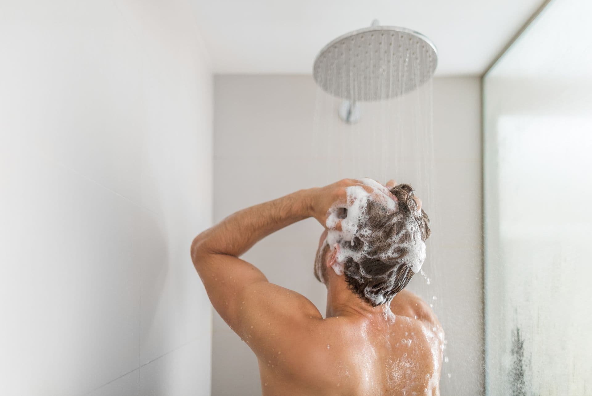 fewa-main-bigstock-Man-taking-a-shower-washing-ha-330758296.jpg