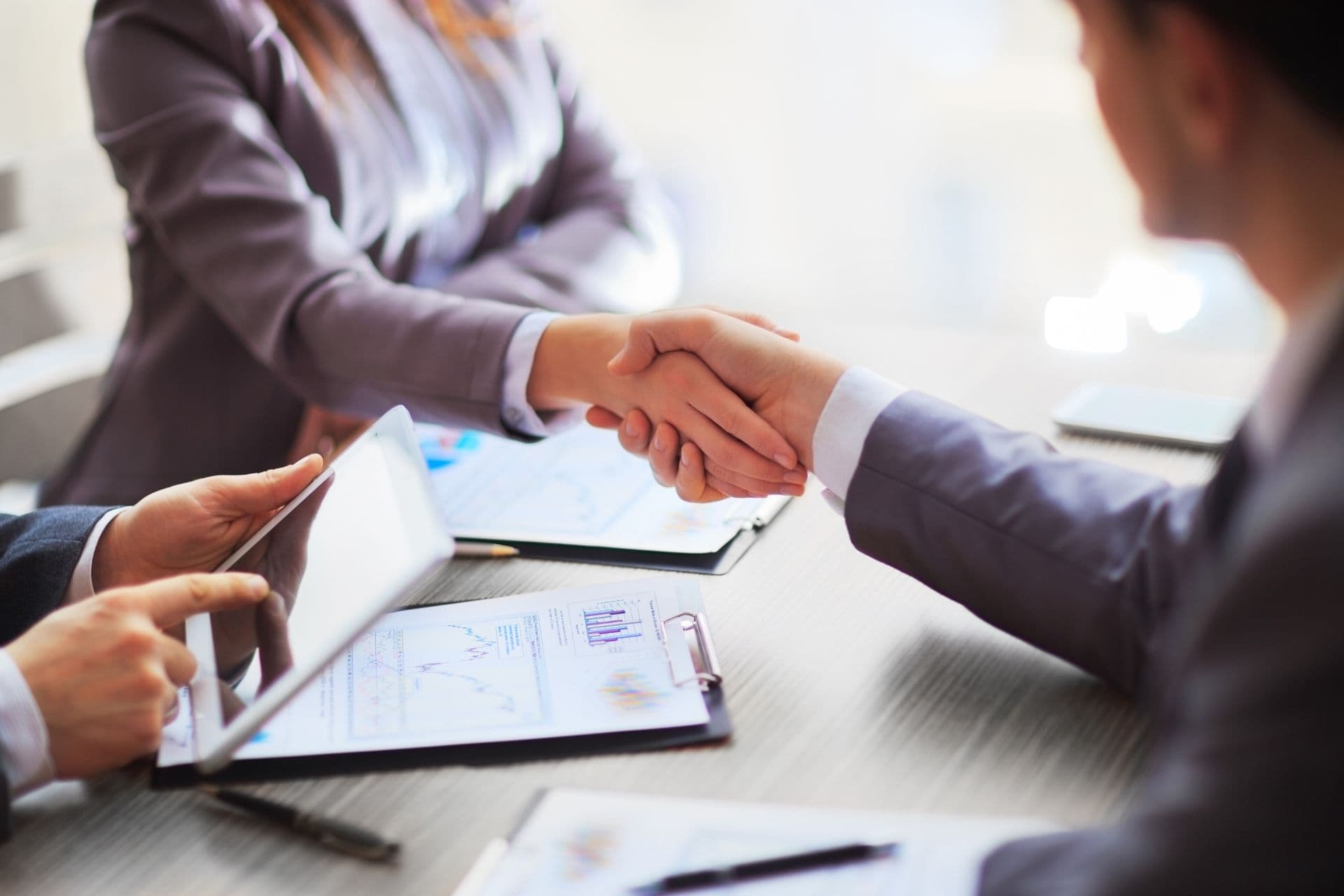 Business people shaking hands finishing up a meeting.