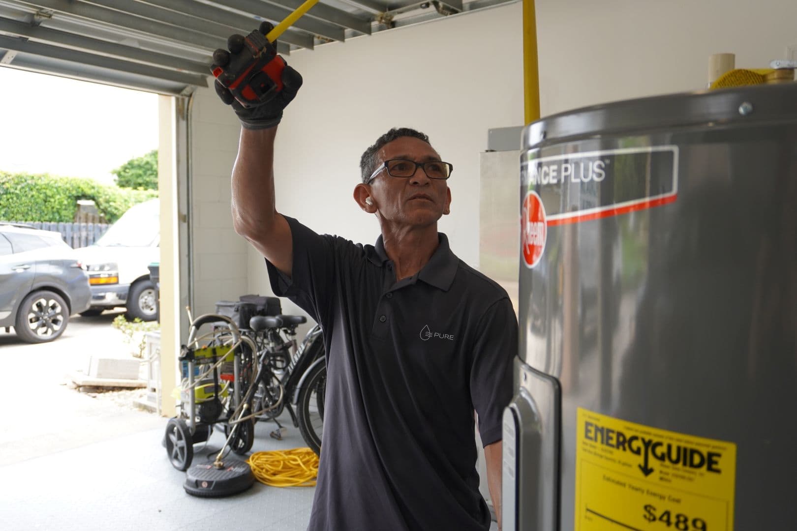 A FEWA employee installs a water heater.